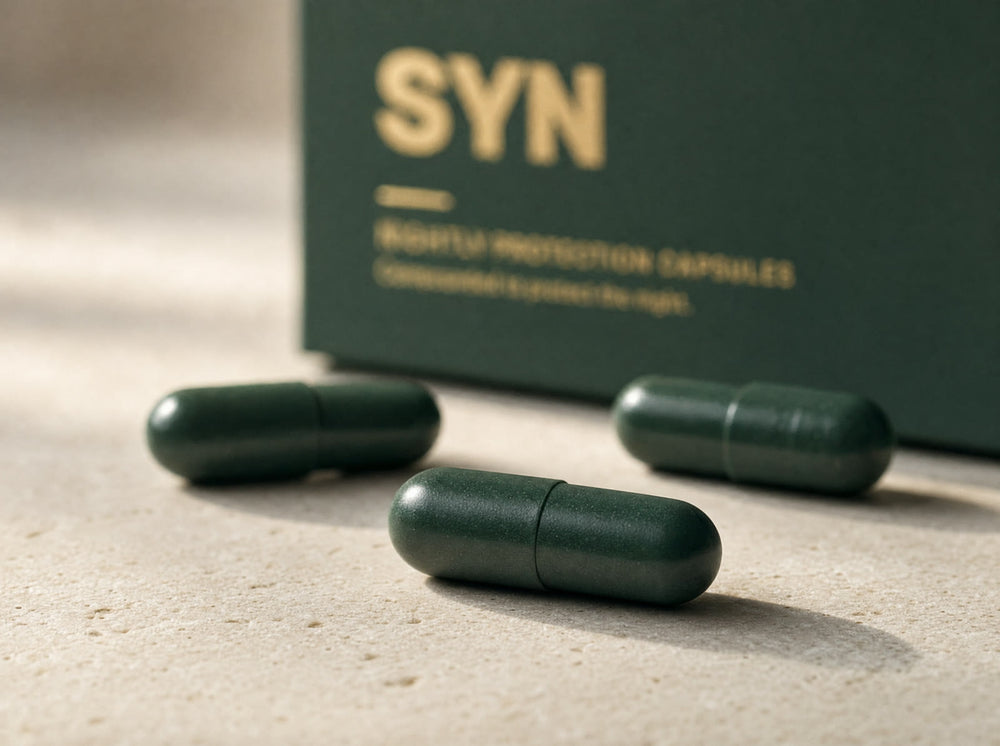 SYN capsules in front of the box